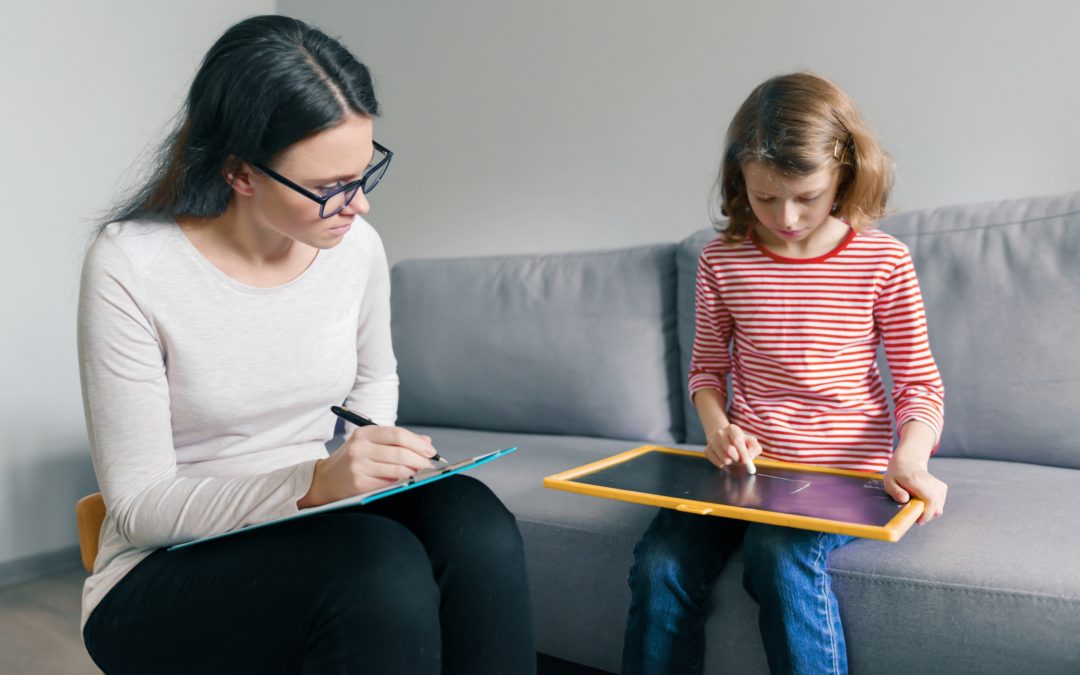 NDIS child Psychologist doing therapy in the home